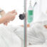 Salt Water Hydration. Older lady in hospital receiving an IV to rehydrate her using salt water hydration method.
